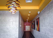 Thumbnail 35 of 36 - Residential hallway with decorative lighting and mailboxes at 68 Beale Apartments, Quincy, 02169